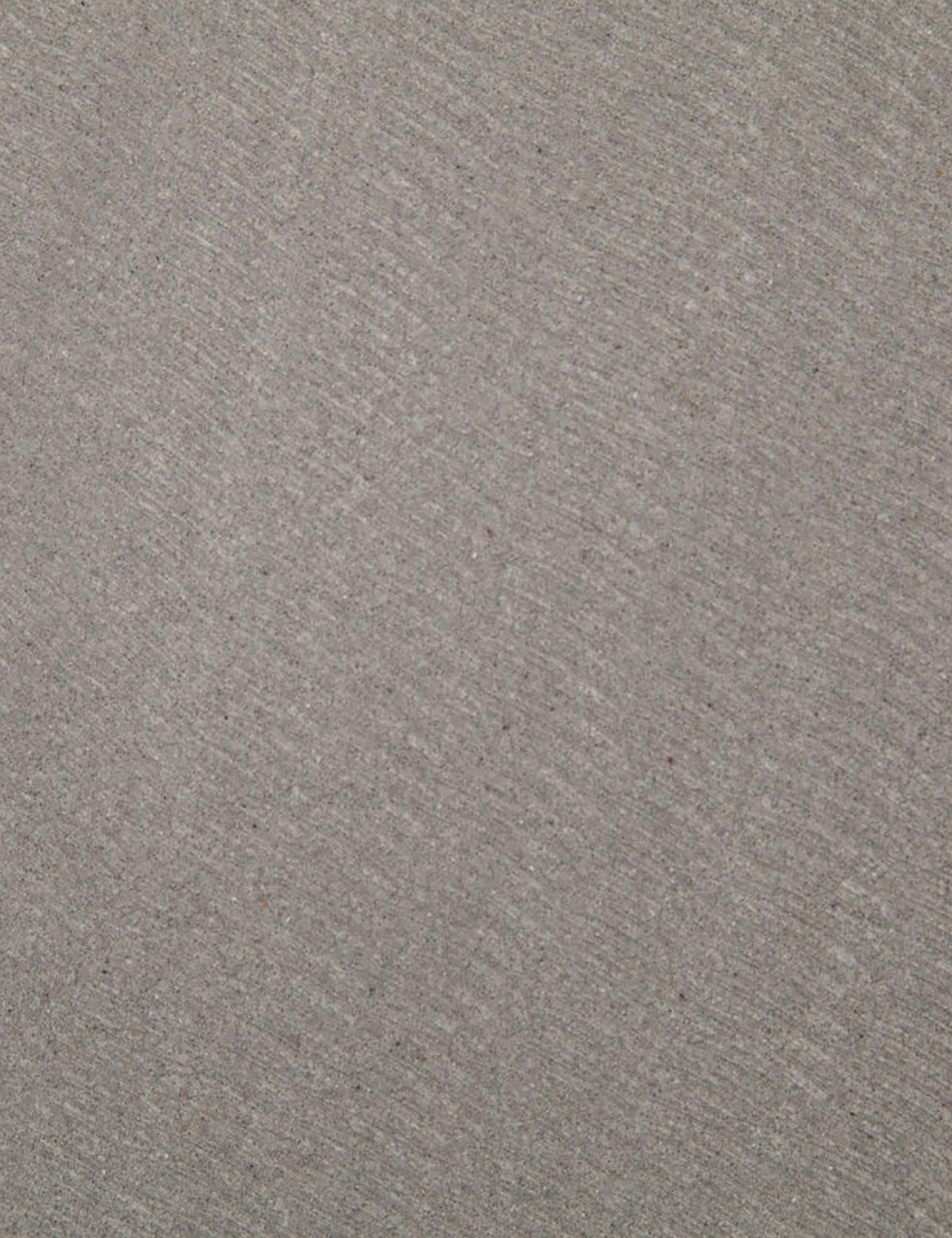 | Detailed view of the lavastone material on the surface of the Agatha indoor and outdoor dining table with black iron base