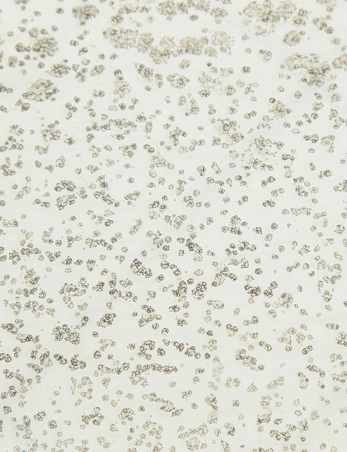 | Detailed view of the texture of the mirror ash glass top on the Bridget bronze pedestal side table