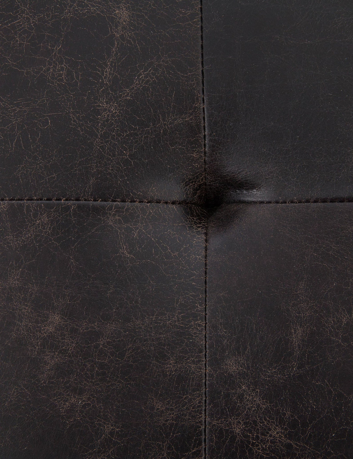 | The tufted finish of the Olwina Square Leather Coffee Table