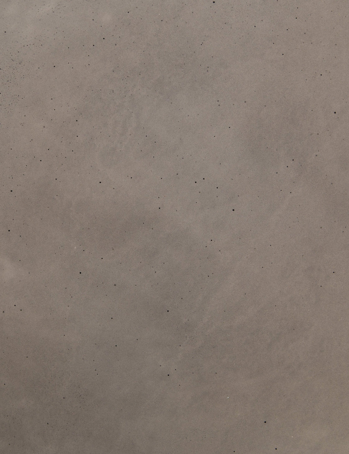 | Detailed view of the concrete material in the Glyn concrete indoor and outdoor side table with carved finish
