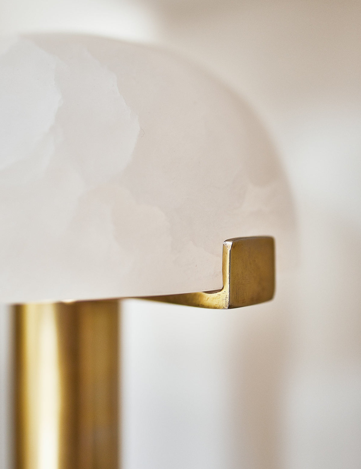 | Close-up of the golden accent on the half-moon shade of the Lelani table lamp