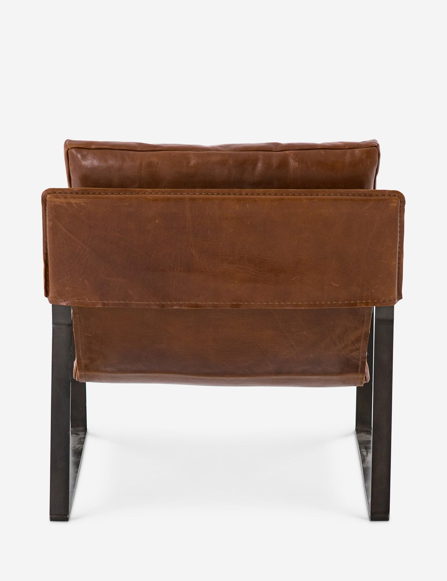 | Rear view of brown leather Marlyne sling-back accent chair with black metal frame
