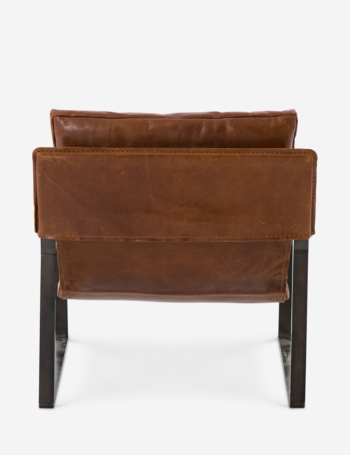 | Rear view of brown leather Marlyne sling-back accent chair with black metal frame