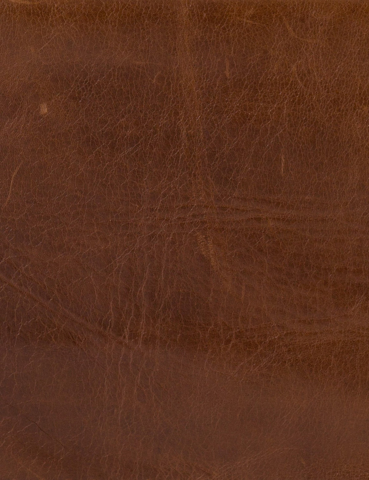 | Close-up of the brown leather for the Marlyne accent chair
