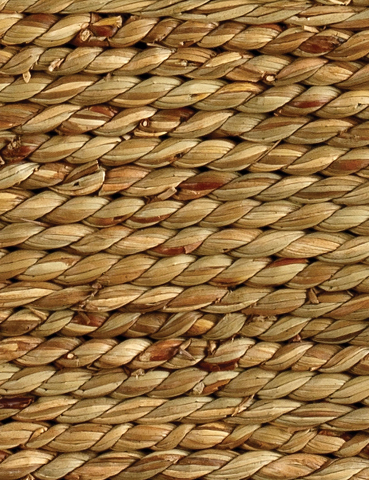 | Close up of the Taina hexagonal braided seagrass side table.
