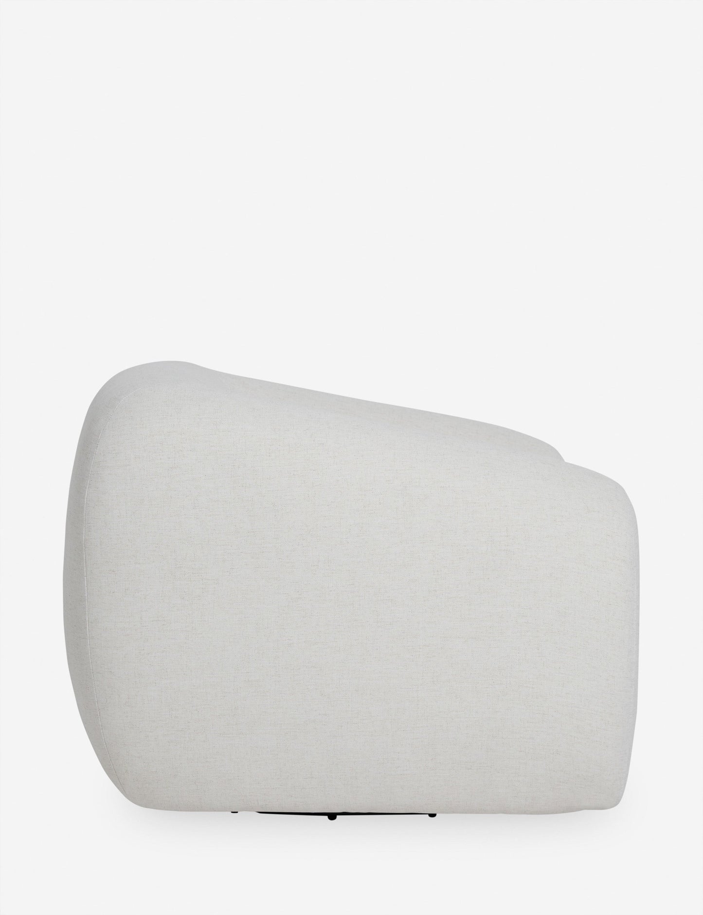 | Side view of the Harlowe softly sculpted plush swivel accent chair.