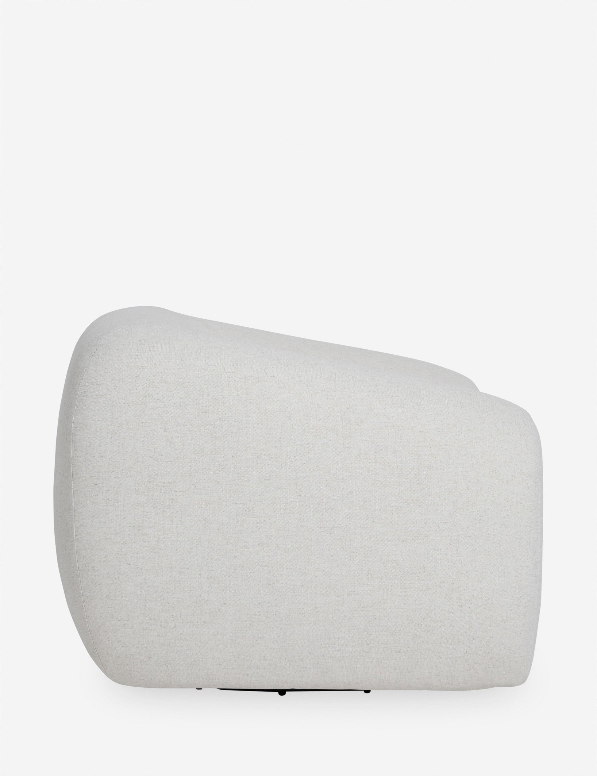 | Side view of the Harlowe softly sculpted plush swivel accent chair.