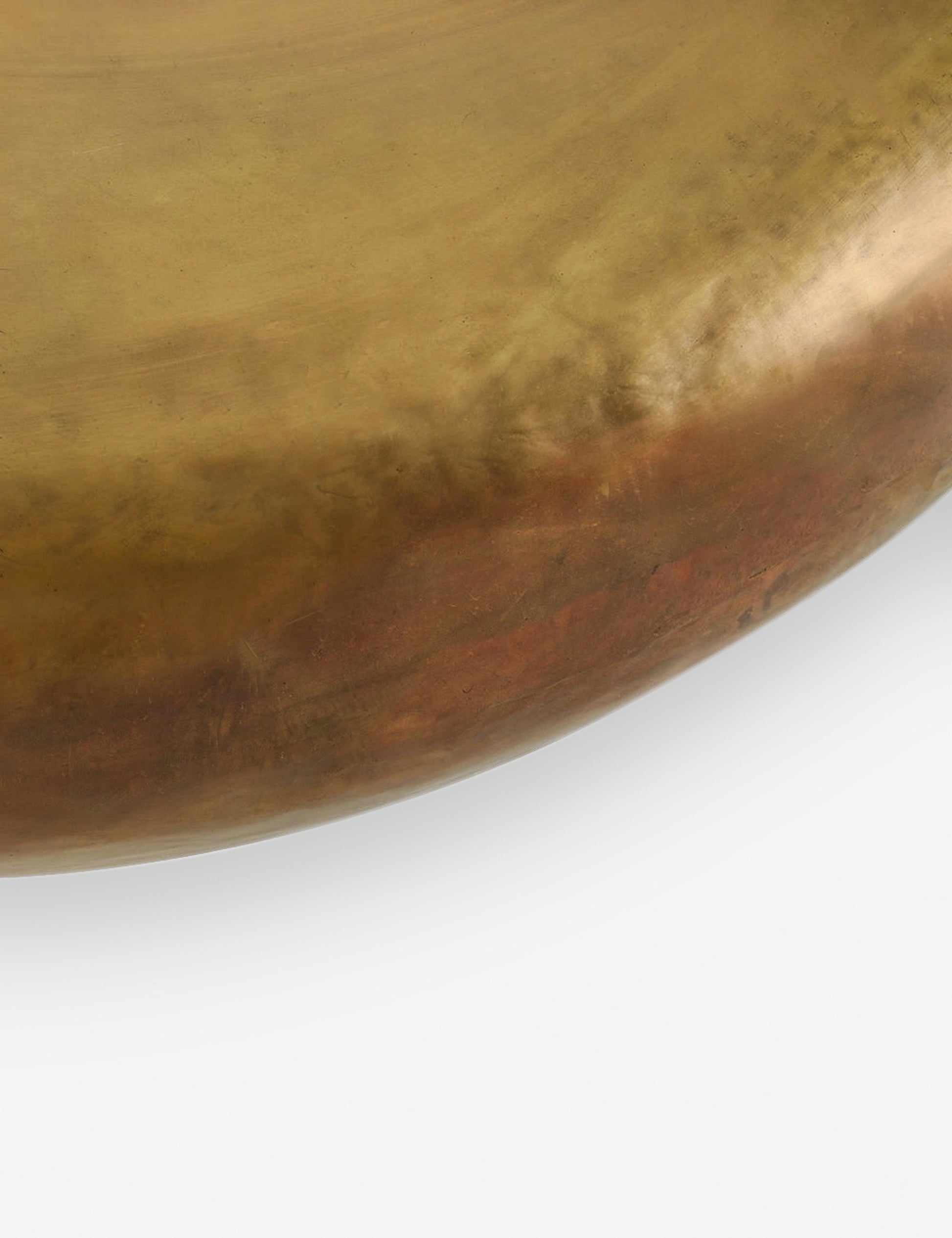 | Close-up of the surface of the Arteriors bates round metallic coffee table