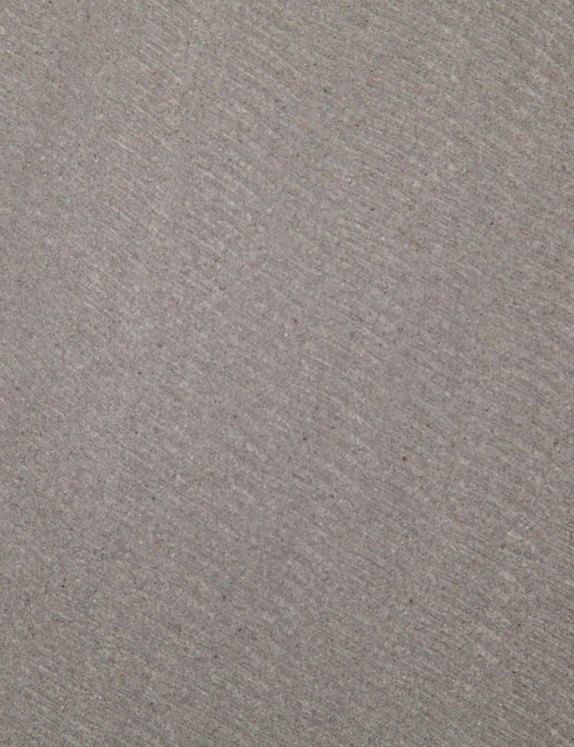 | Detailed view of the lavastone material on the surface of the Agatha indoor and outdoor dining table with black iron base