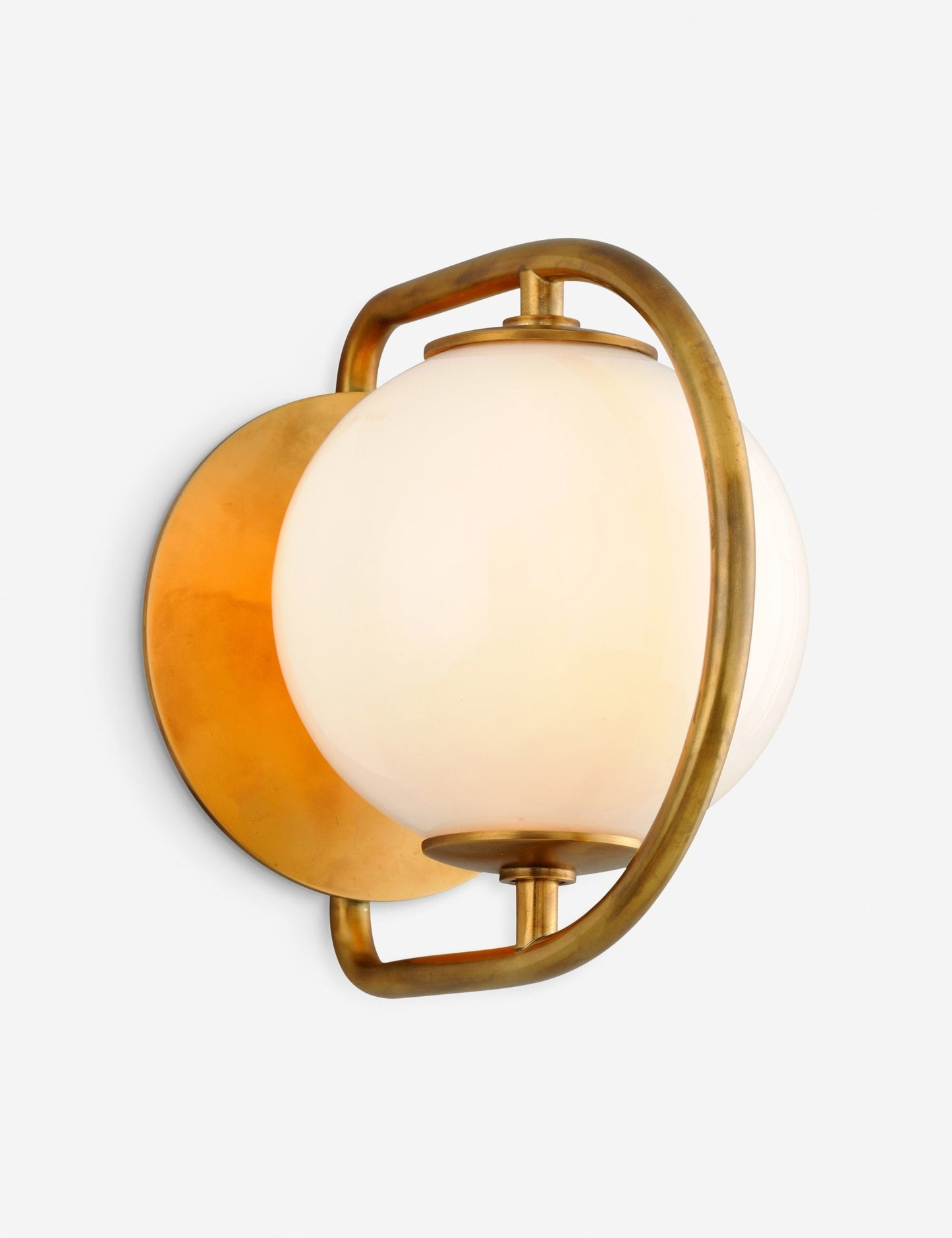 | Angled view of the Evangeline diffused white glass orb sconce with brass frame