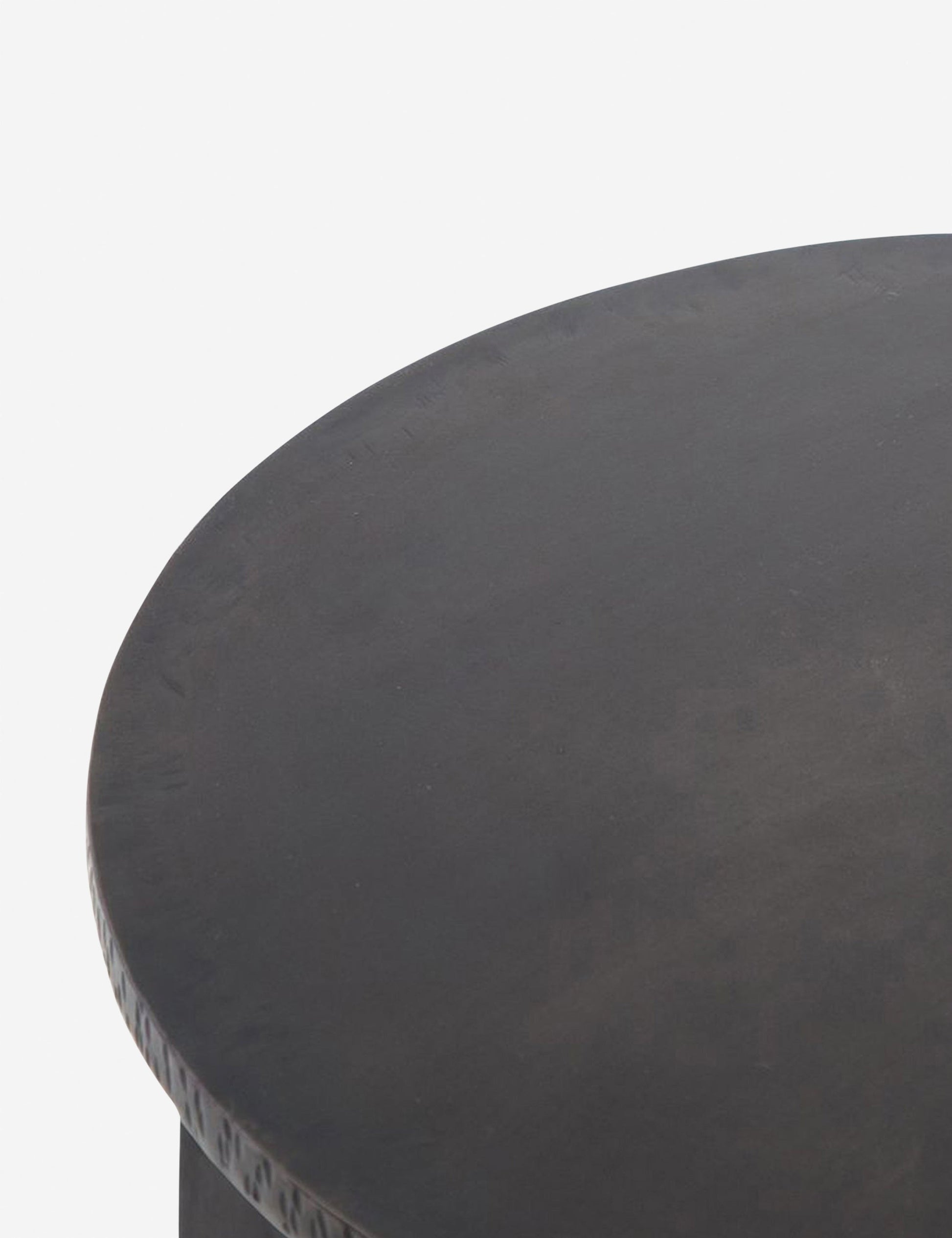 | Close-up of the surface of the Illy metal geometric side table
