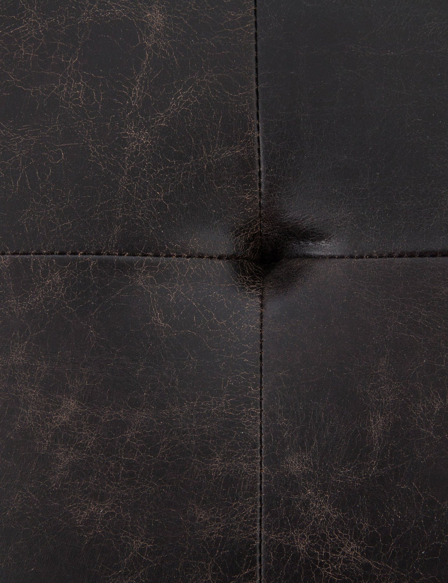 | The tufted finish of the Olwina Square Leather Coffee Table